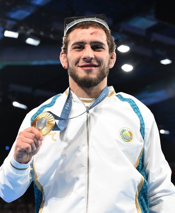 media-razambek_zhamalov_holding_his_2024_summer_olympics_gold_medal_-cropped